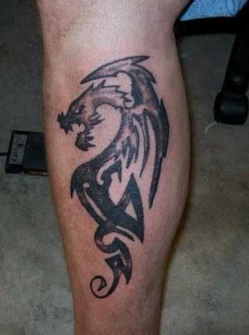 Bold blackwork dragon emblem tattoo
