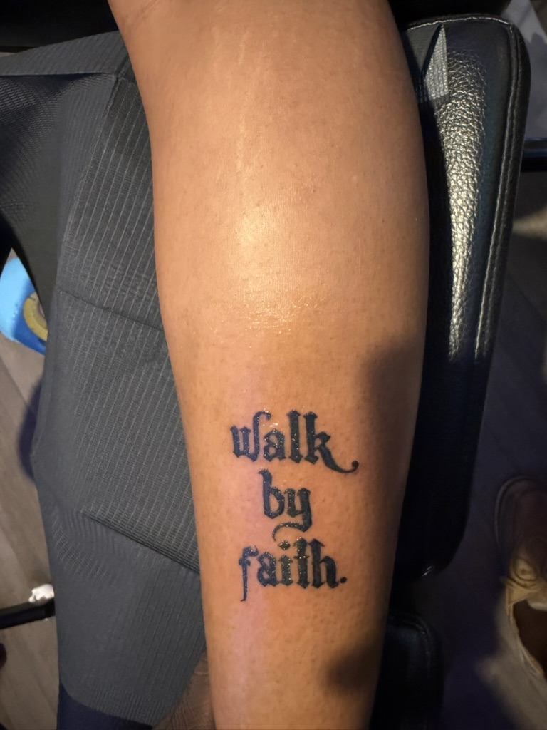 Walk by faith script tattoo on calf